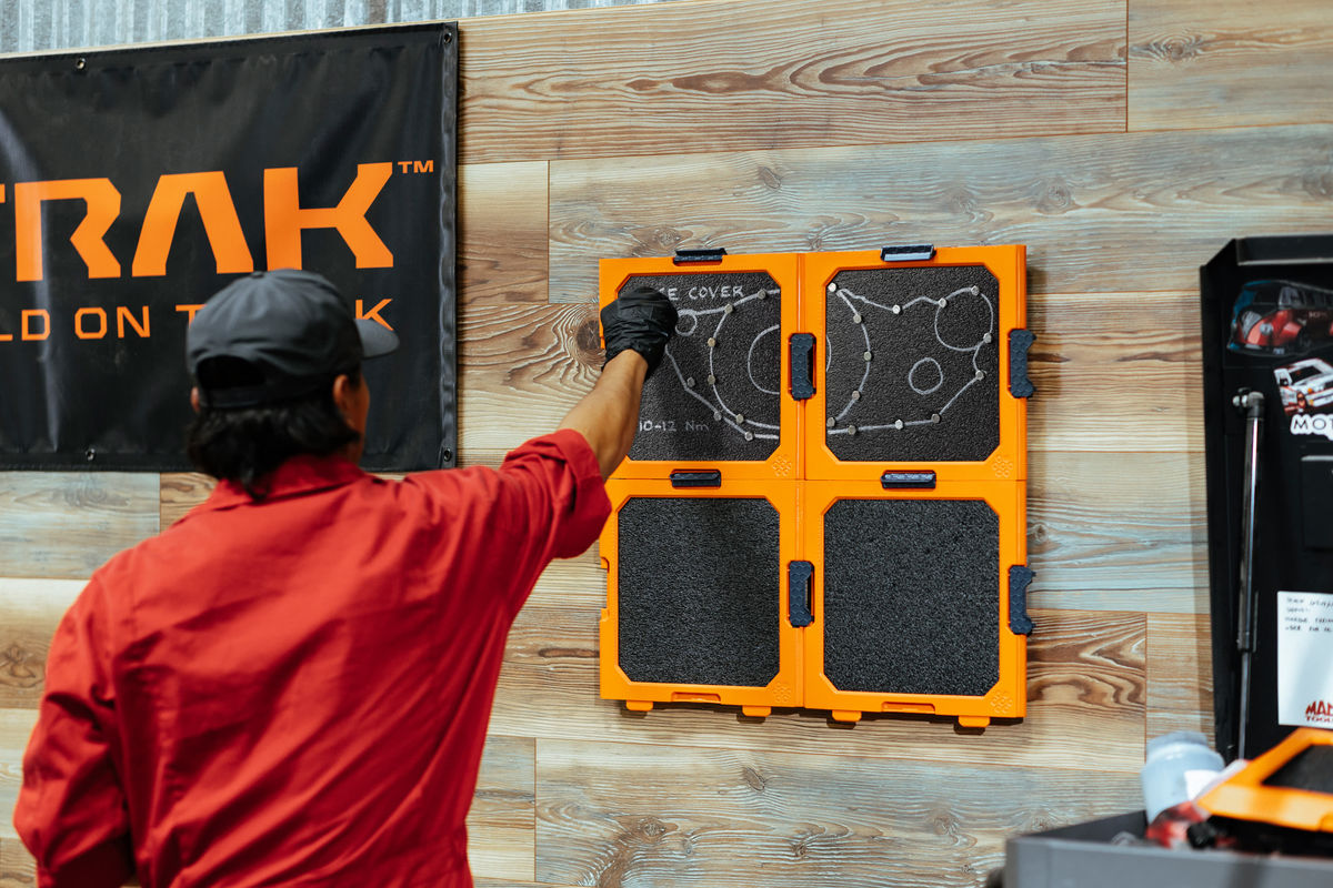 Technician using BILDTRAK during a workshop rebuild
